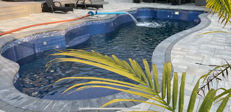 New pool installation being filled with fresh water in Ottawa