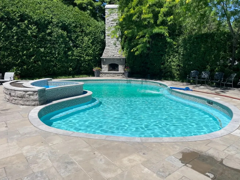 Pool water delivery service filling a backyard swimming pool in Ottawa