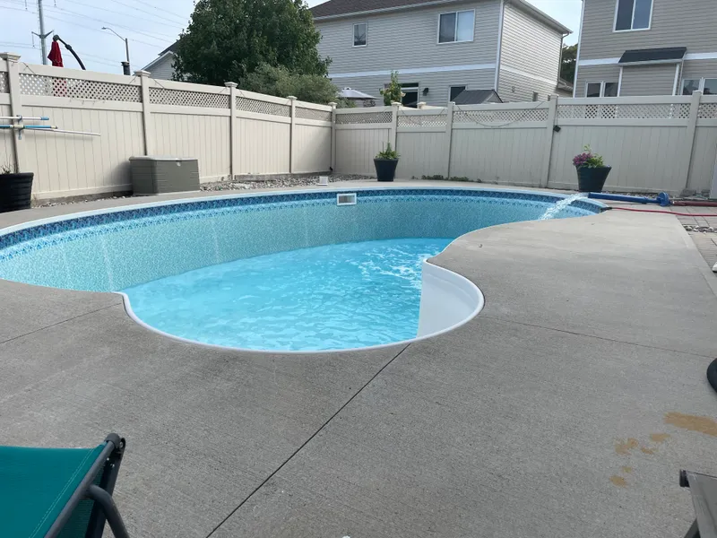 Pool water delivery hose connected and filling a swimming pool in Ottawa